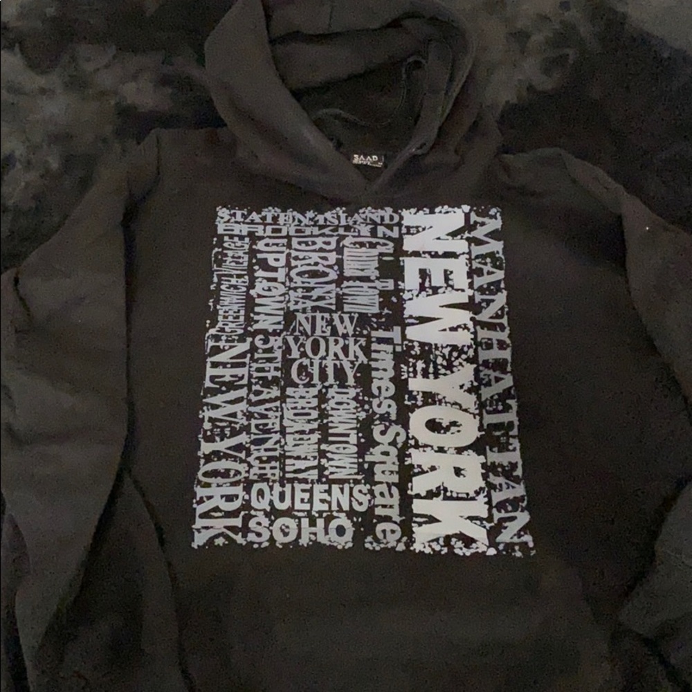New York black hoodie with front pouch. M.